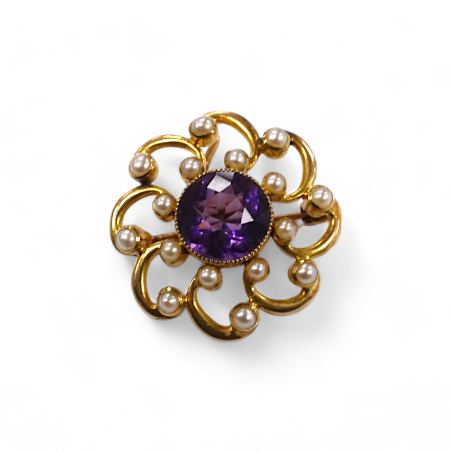 A yellow metal, amethyst and seed pearl cluster set circular pendant brooch, 24mm, gross weight 6.3 grams. Condition - fair to good